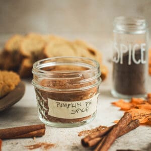 Homemade pumpkin pie spice recipe in a small jar.