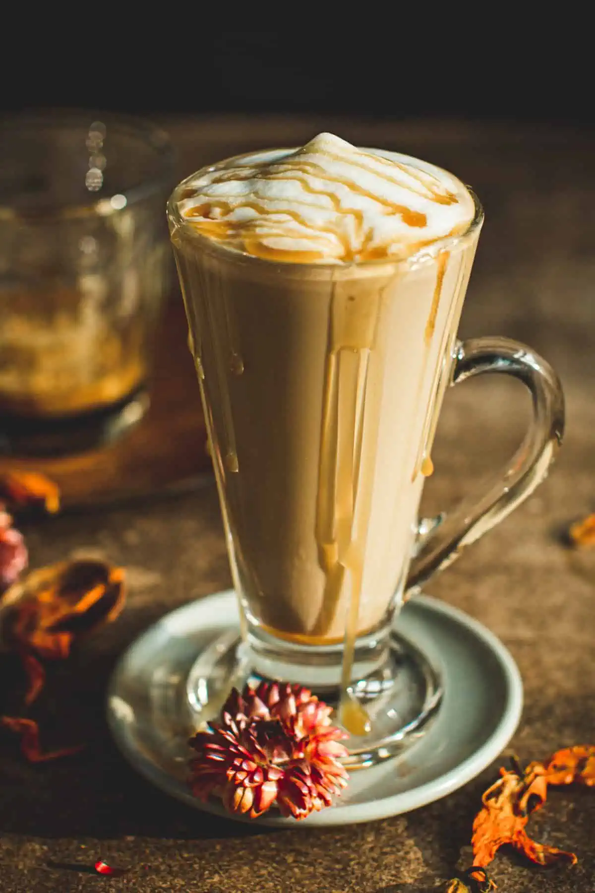 Caramel latte topped with caramel sauce.