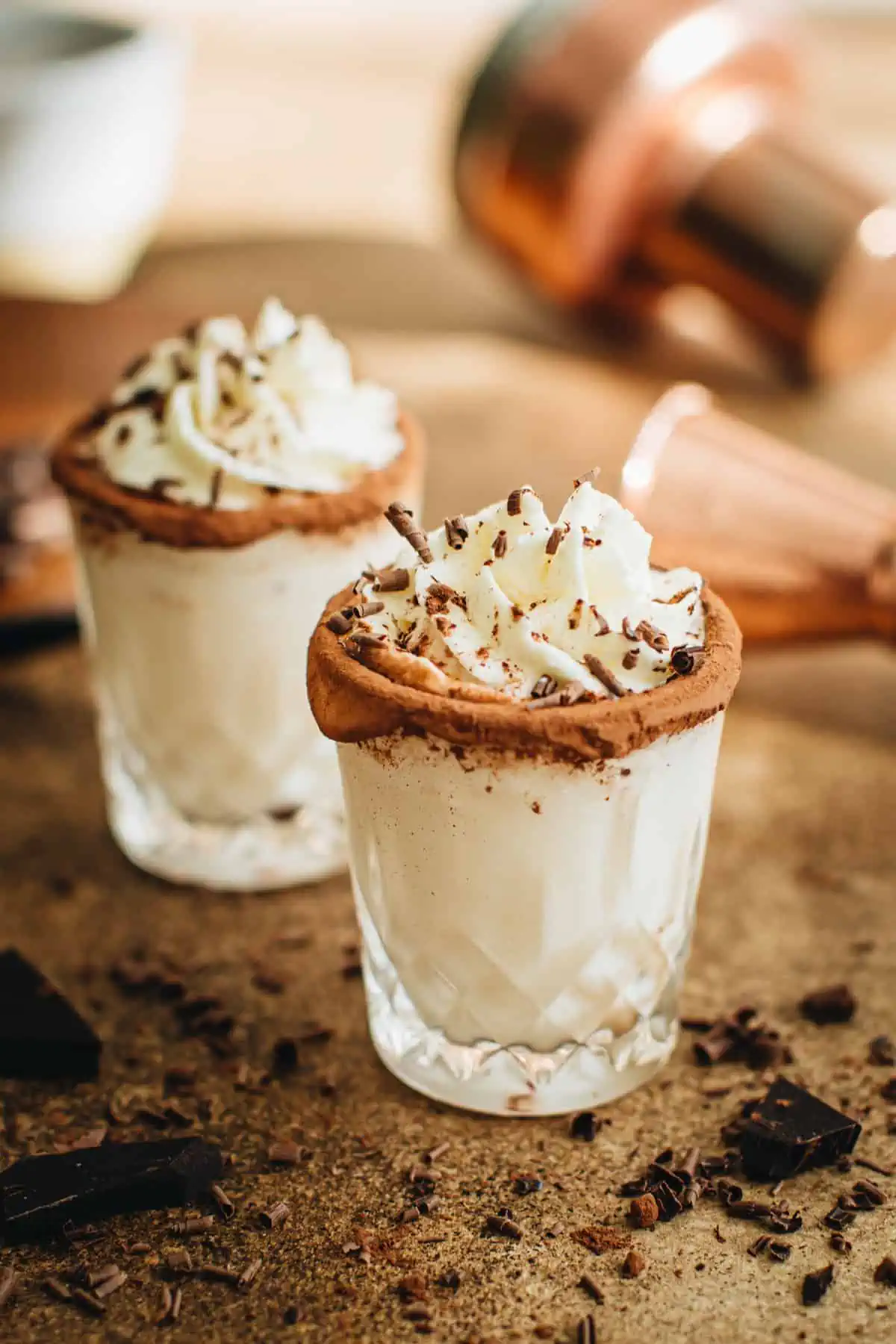 Chocolate cake shots with Frangelico and topped with whipped cream.