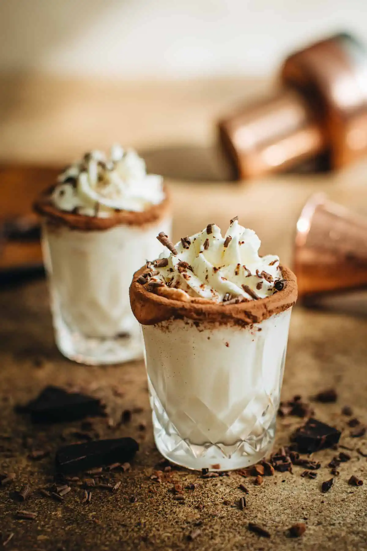 Chocolate cake shot topped with whipped cream.