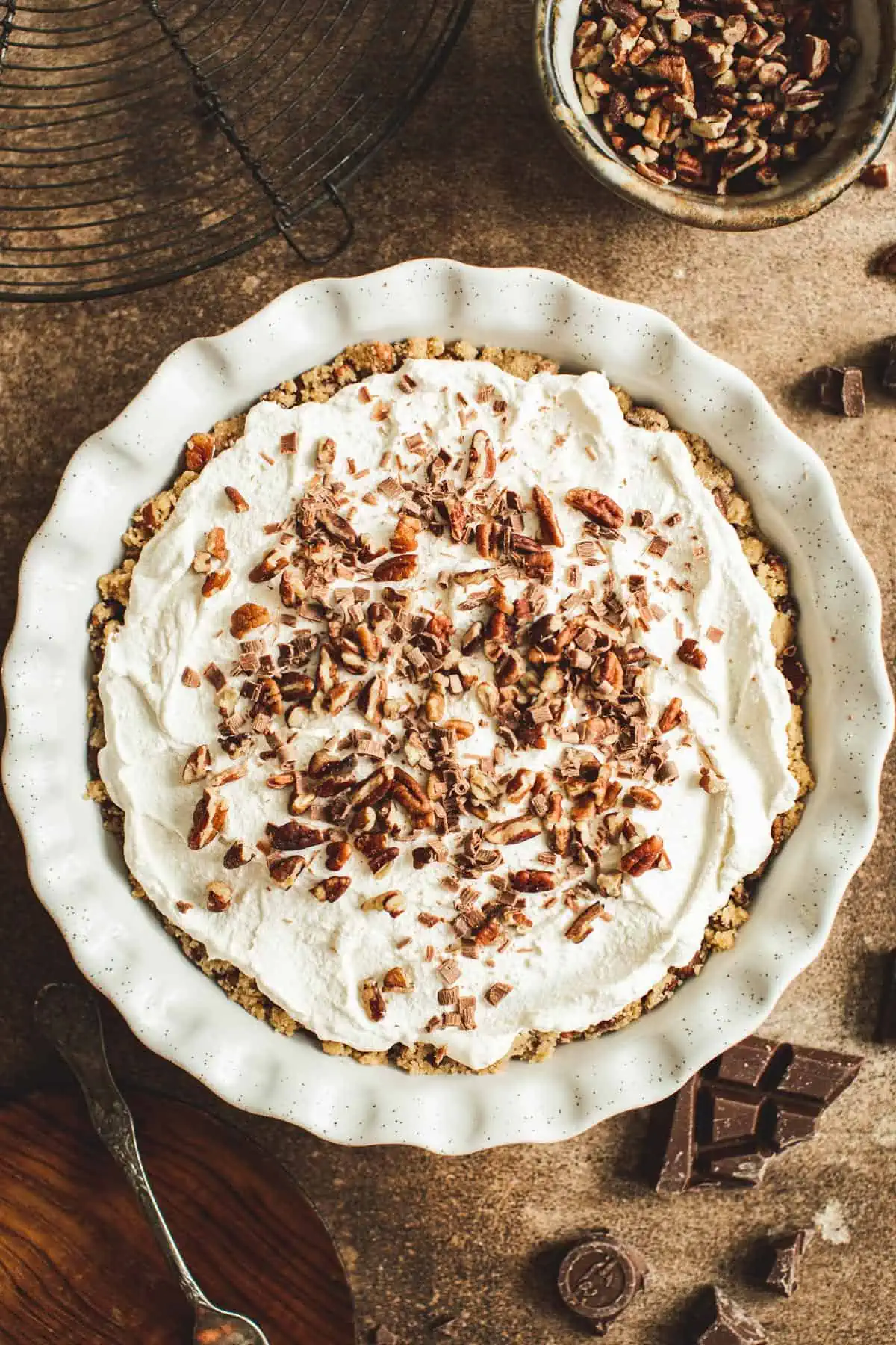Cinnamon whipped cream spread on top of a pie.
