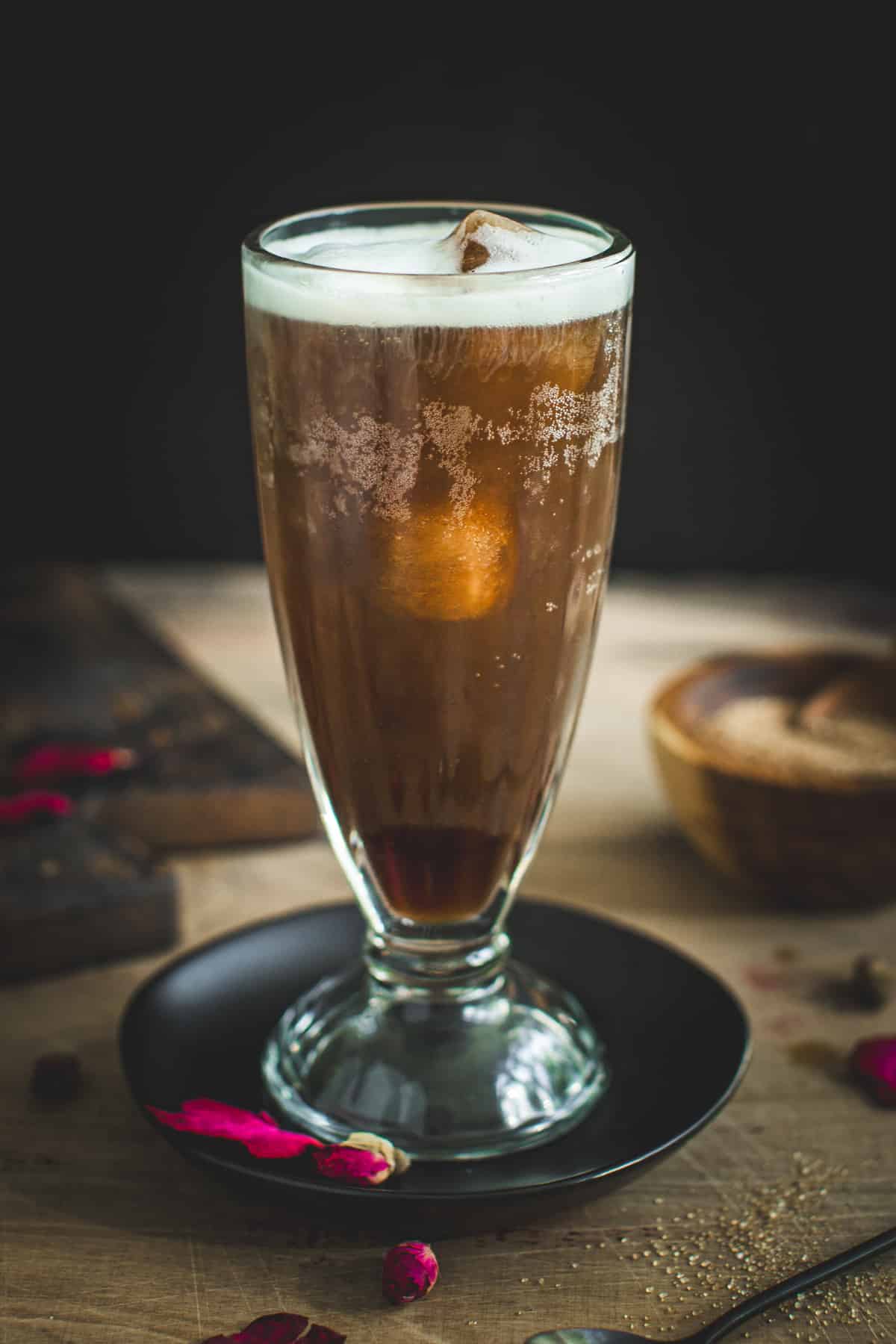 Coffee soda topped with cold foam.