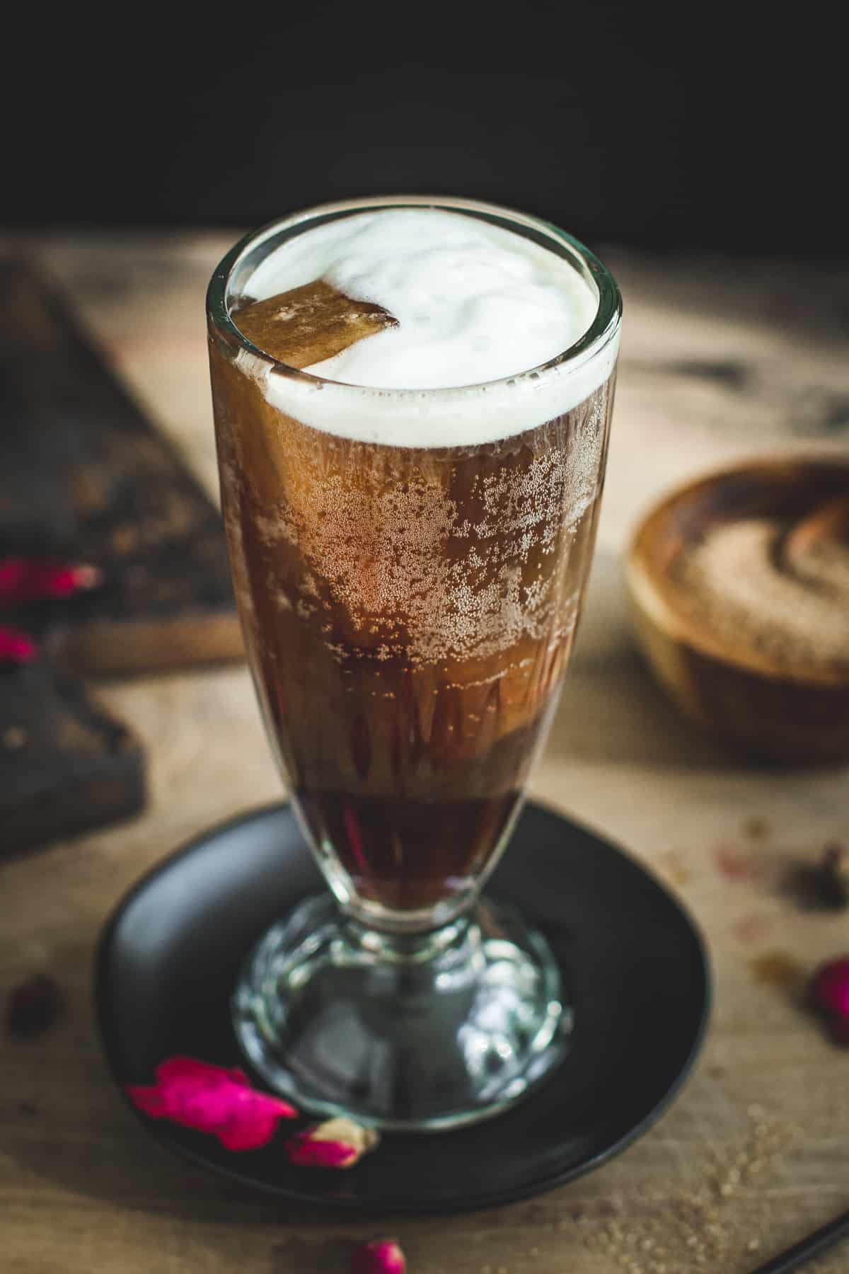 Coffee soda topped with cold foam.