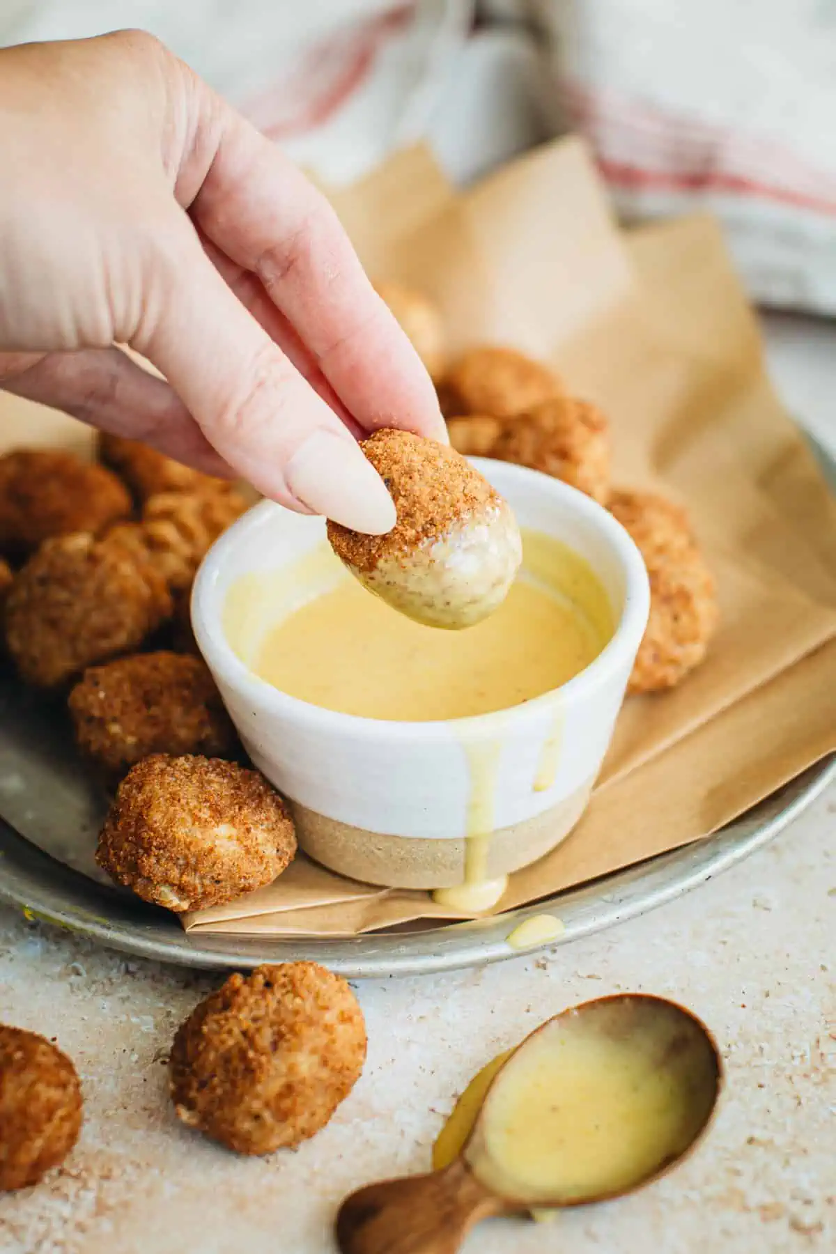 Copycat Chick-fil-a sauce with a nugget dunking into it.