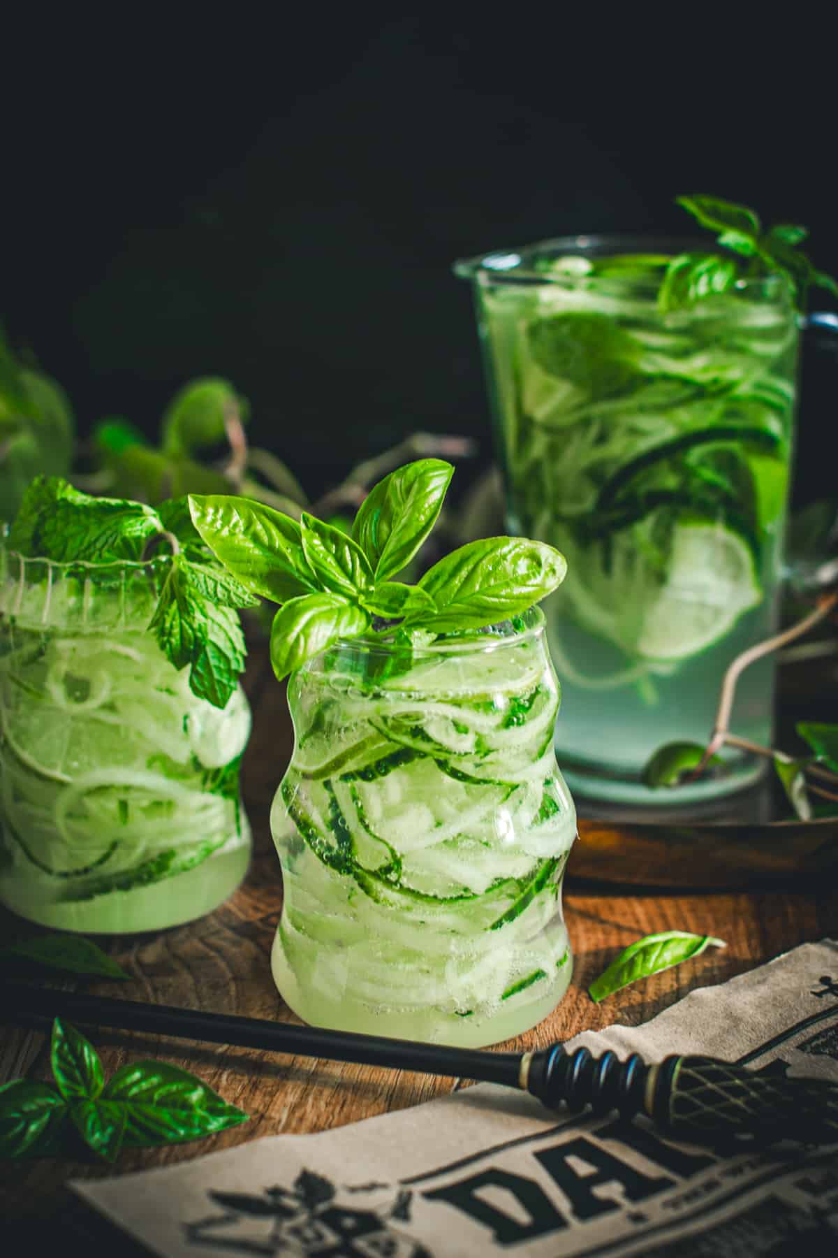 Gillywater in a glass with fresh basil.