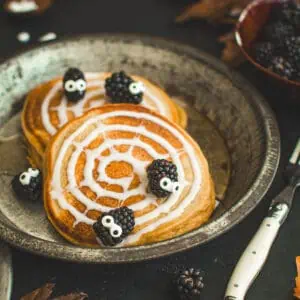 Halloween pancakes with blackberry spiders.