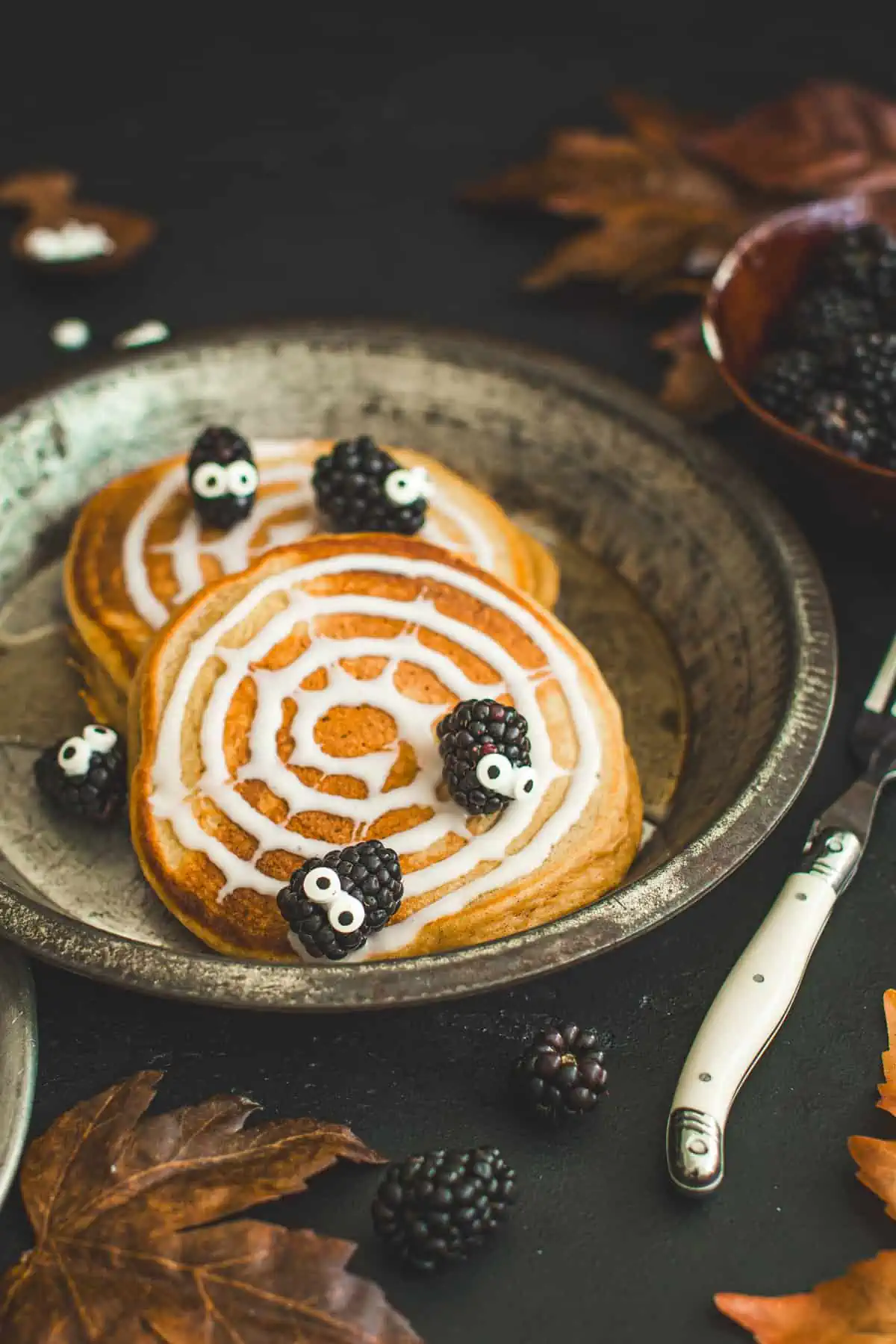 Halloween pancakes with blackberry spiders.