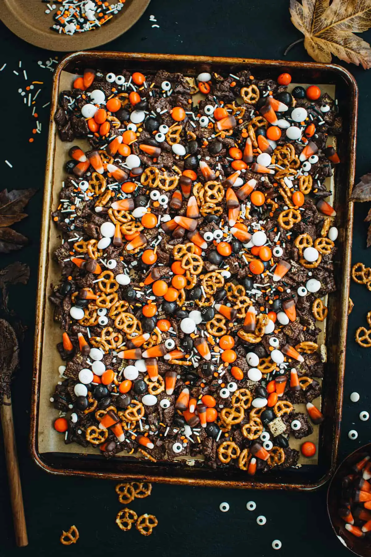 Halloween snack mix on a rimmed baking sheet.