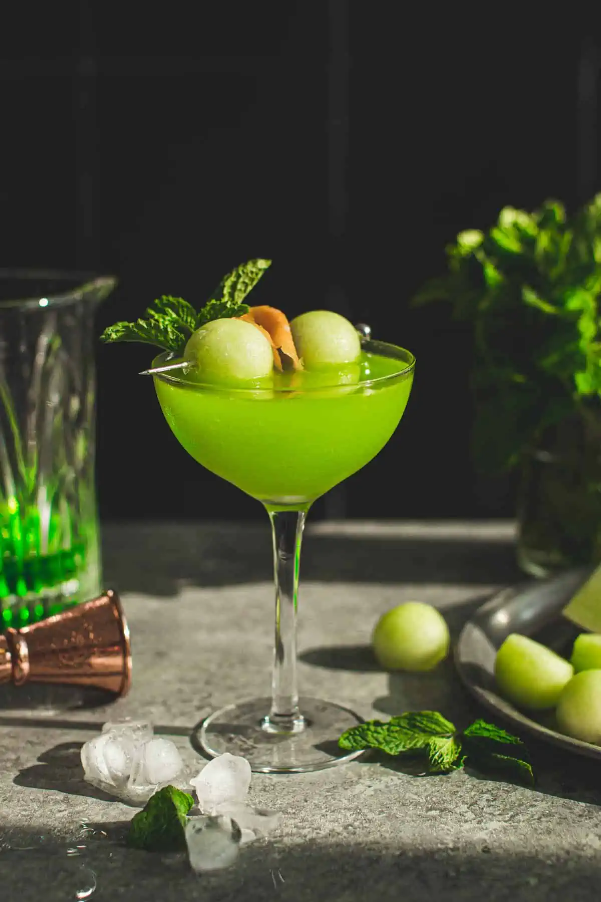 Melon ball drink with melon balls for garnish.