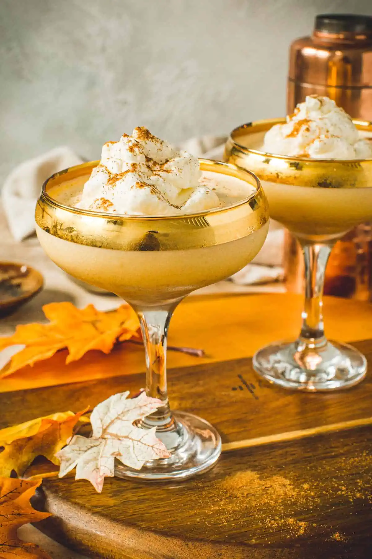Pumpkin pie martini topped with whipped cream.