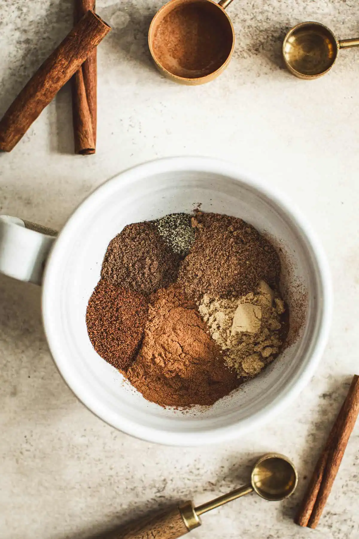 Pumpkin pie spices in a coffee cup.