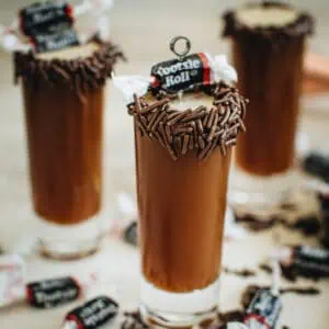 Tootsie Roll shot with a rim covered in chocolate sprinkles.