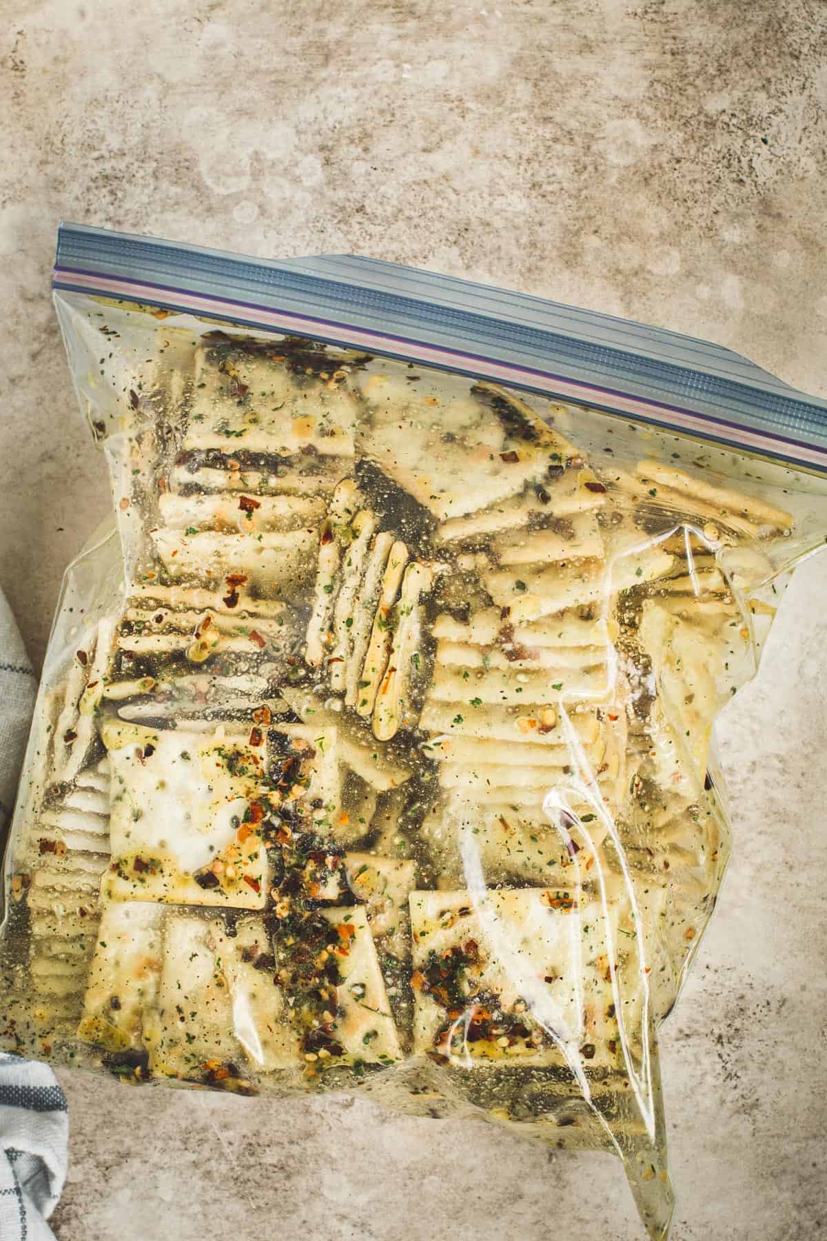 Saltines in a gallon-sized ziplock bag with the ranch seasoned olive oil marinade.