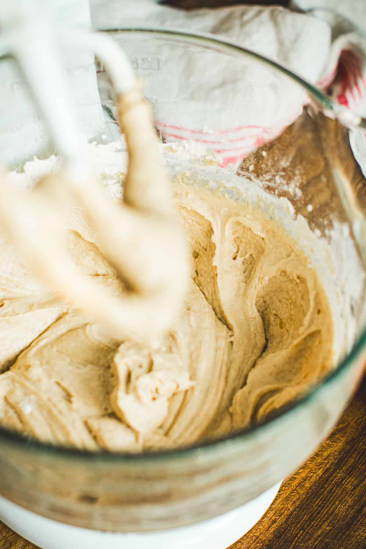 Batter for apple cinnamon muffins in a mixing bowl.