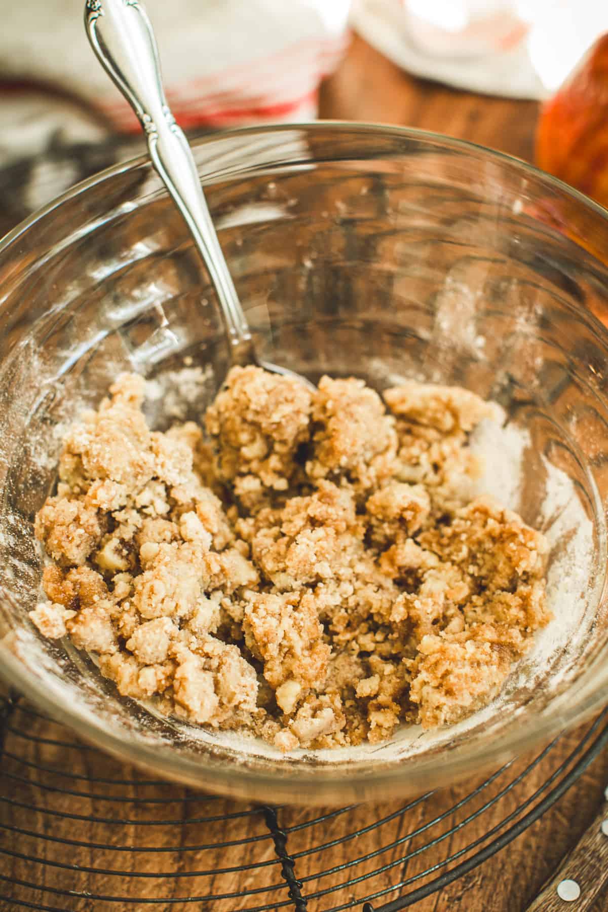 Crumb topping in a mixing bowl for Apple Cinnamon Muffins.