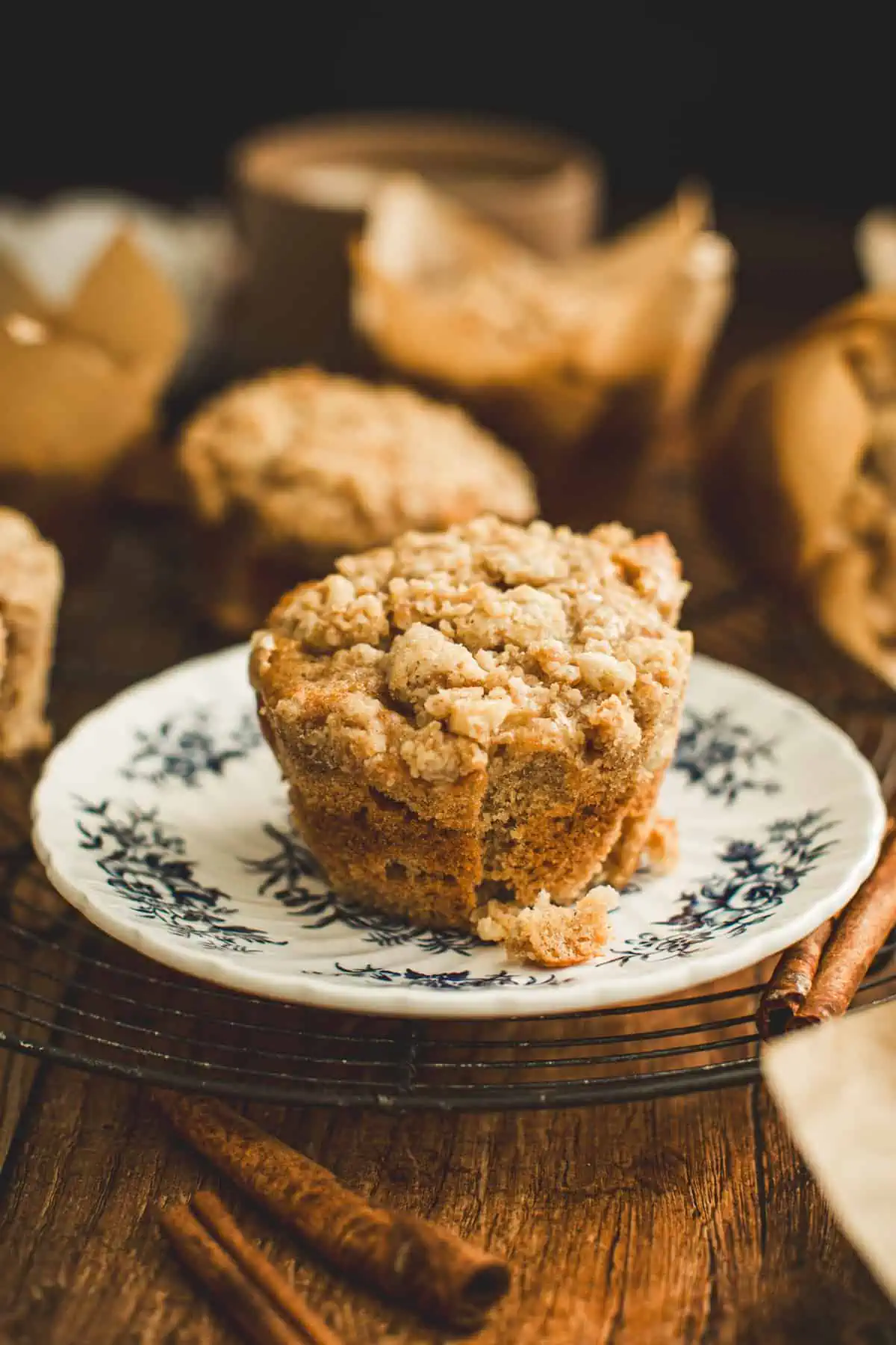 Apple cinnamon muffin on a blue and white plate.