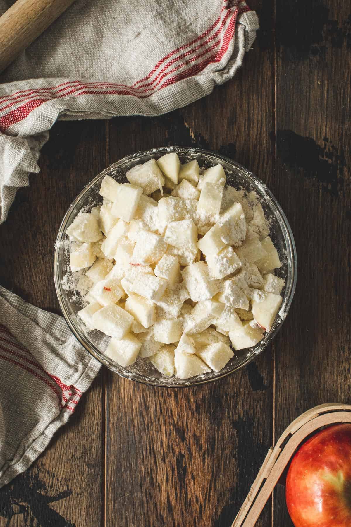 Diced apples coated in flour for the apple crumb cake.