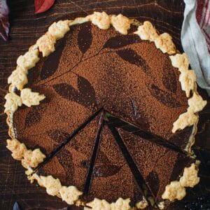 Chocolate Tart with slices cut out.