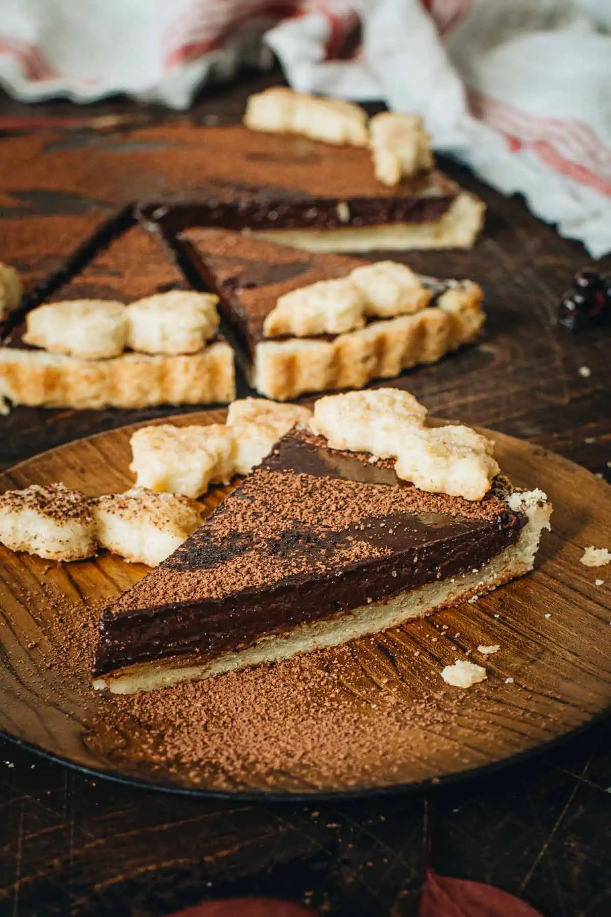 Slice of chocolate tart on a dessert plate.