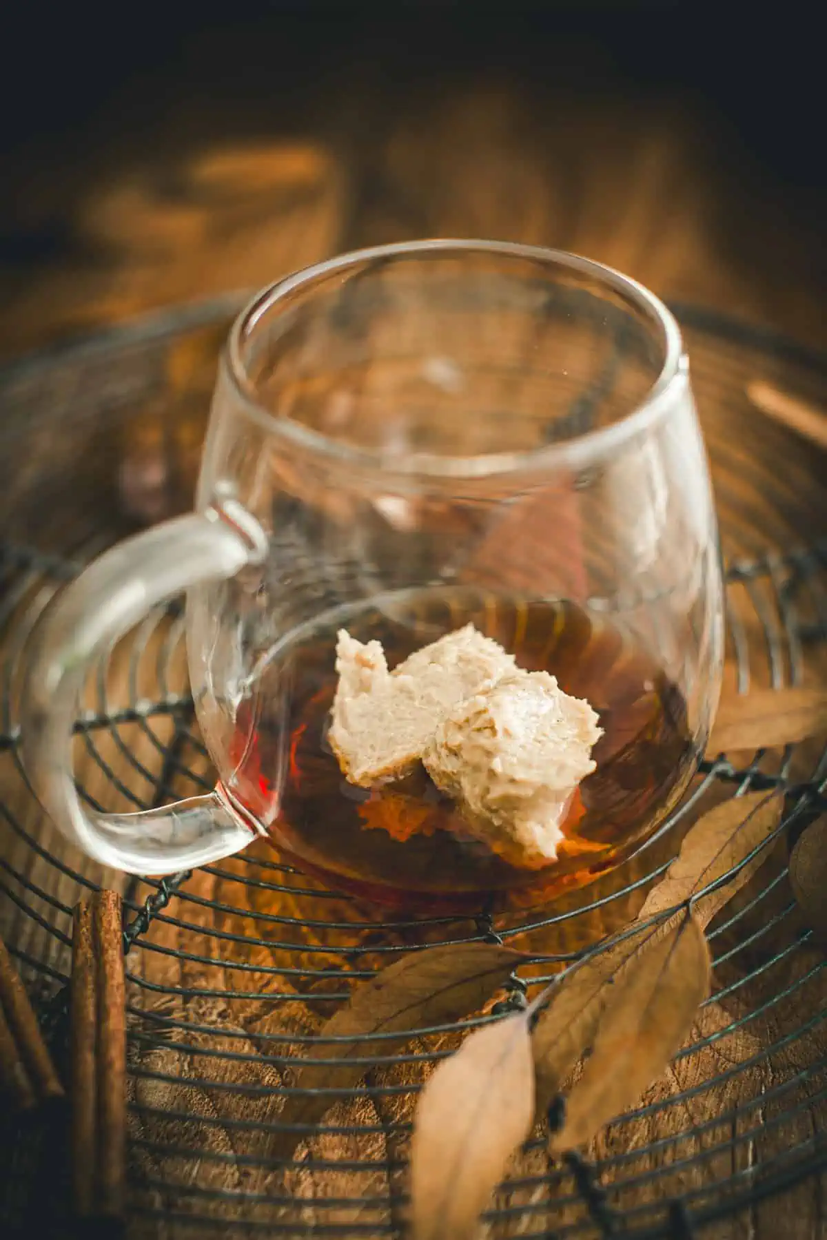 Spiced butter and rum in a glass mug for making hot buttered rum.