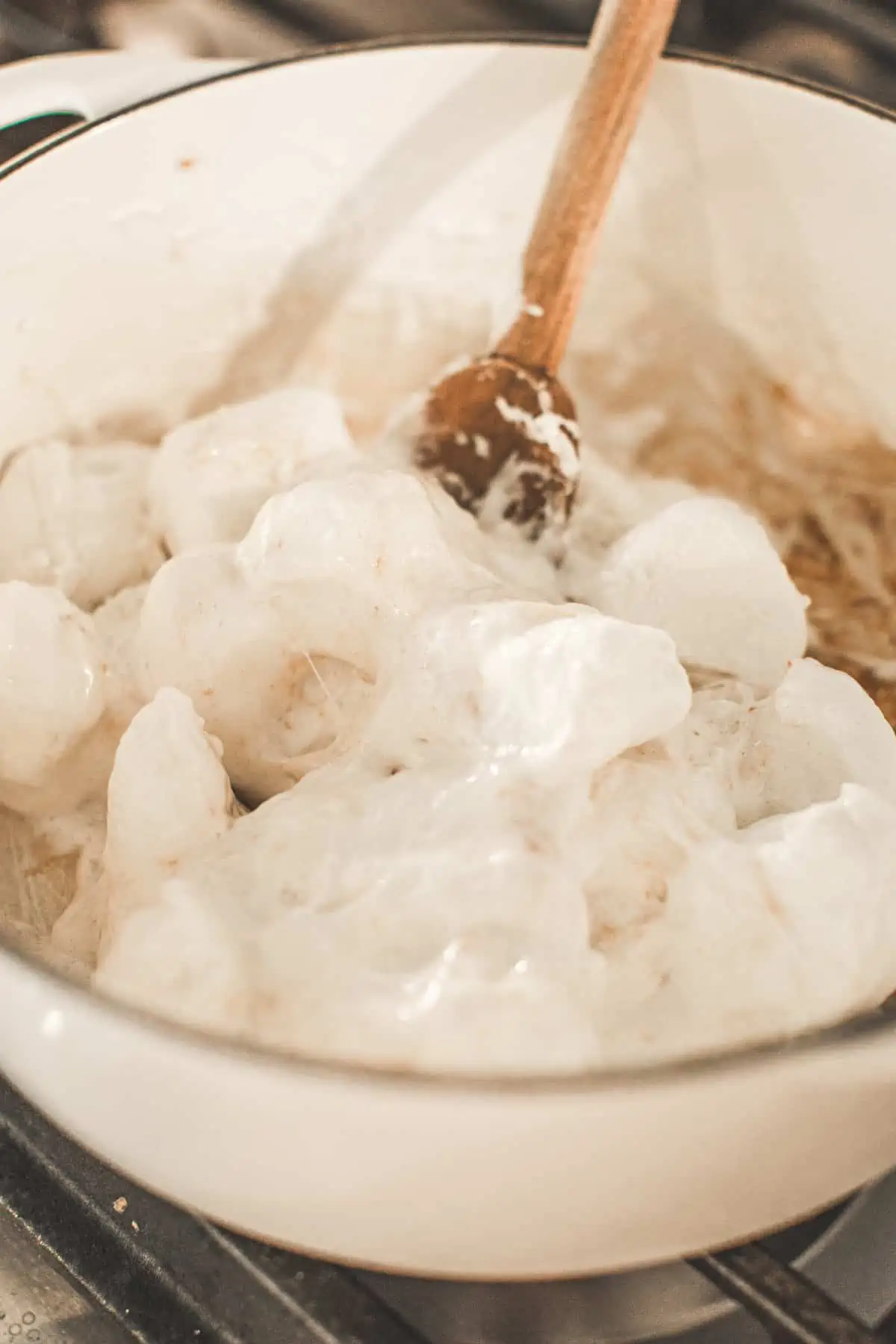 Marshmallows melting in a pot for the No-Bake Pumpkin pie filling.