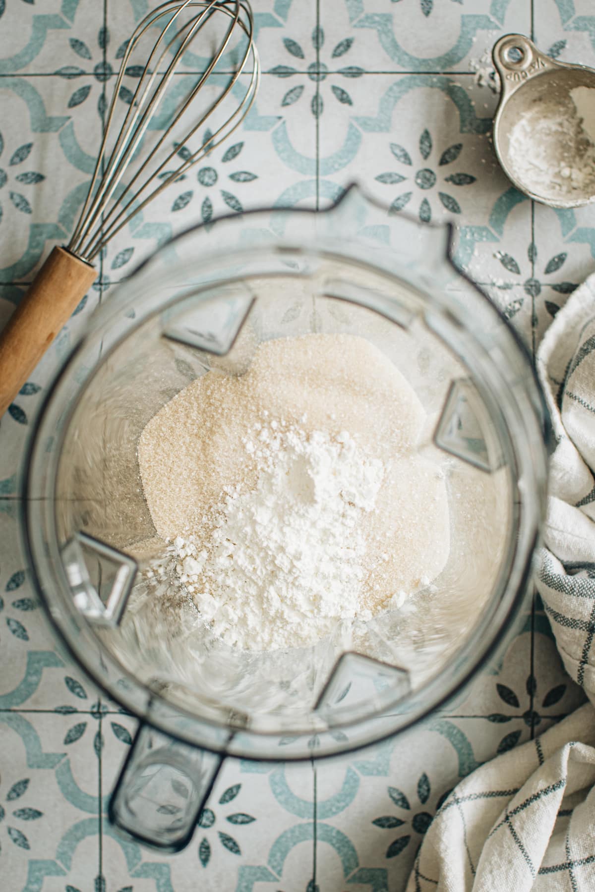 Granulated sugar and cornstarch in a blender for making powdered sugar.