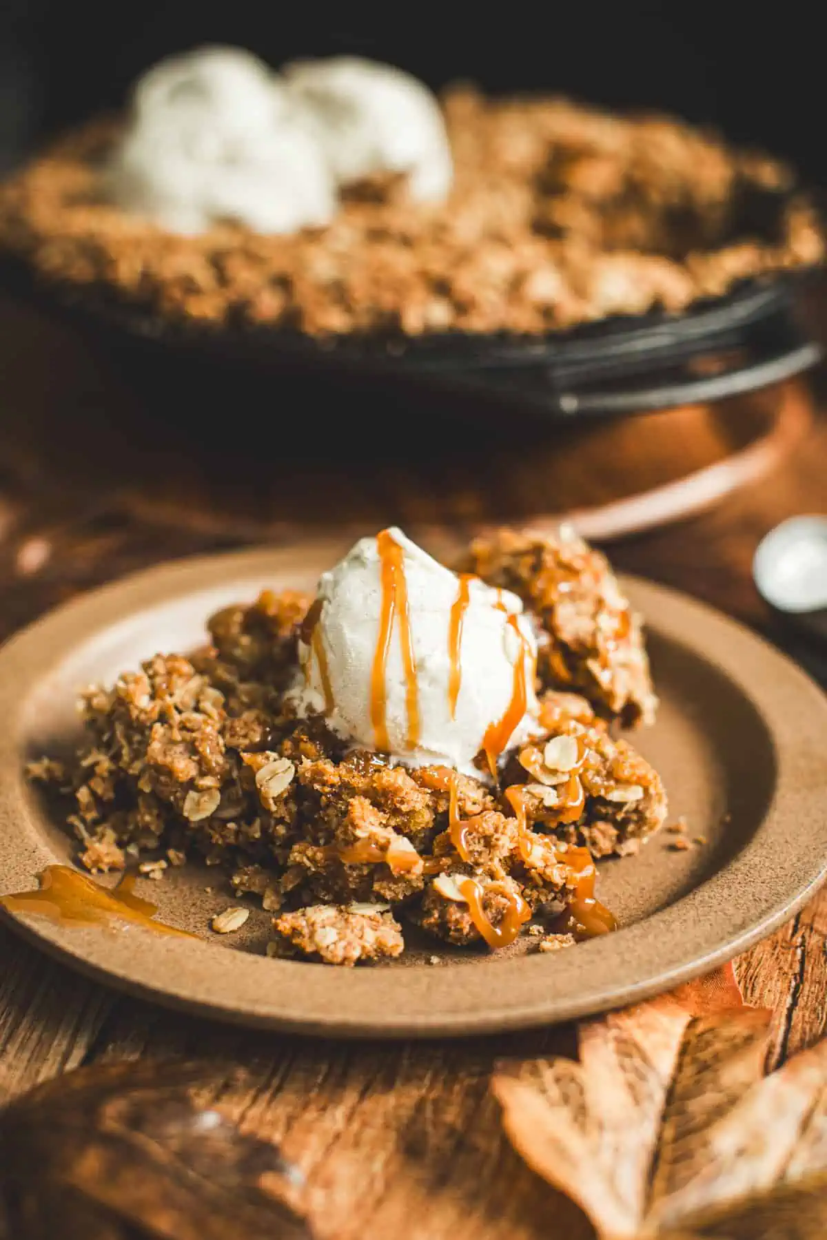 Pumpkin crisp topped with vanilla ice cream and caramel sauce.