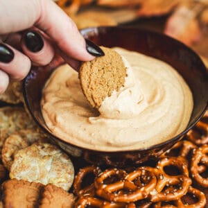 Dipping a ginger snap into pumpkin dip.