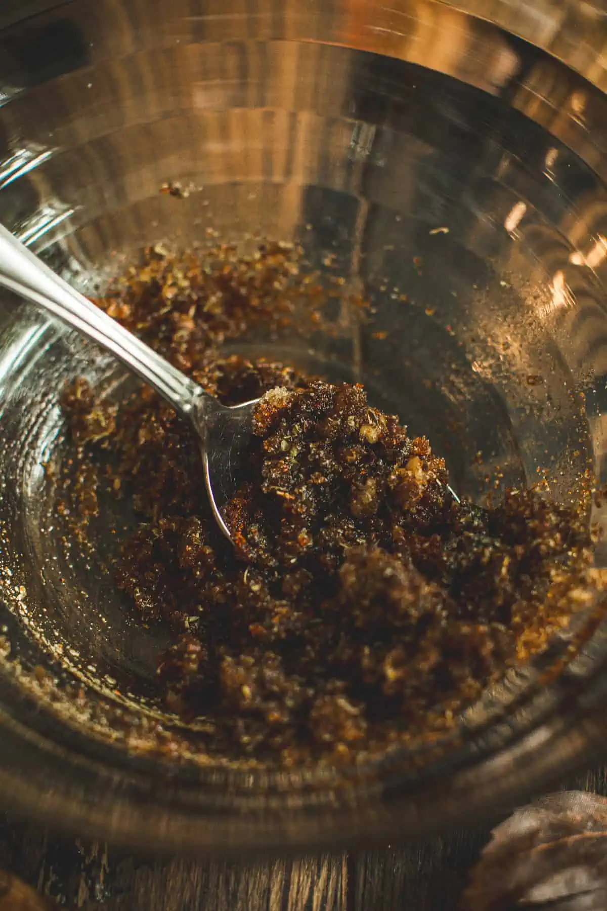 Rub mixture in a bowl with a spoon for slow cooker turkey breast.