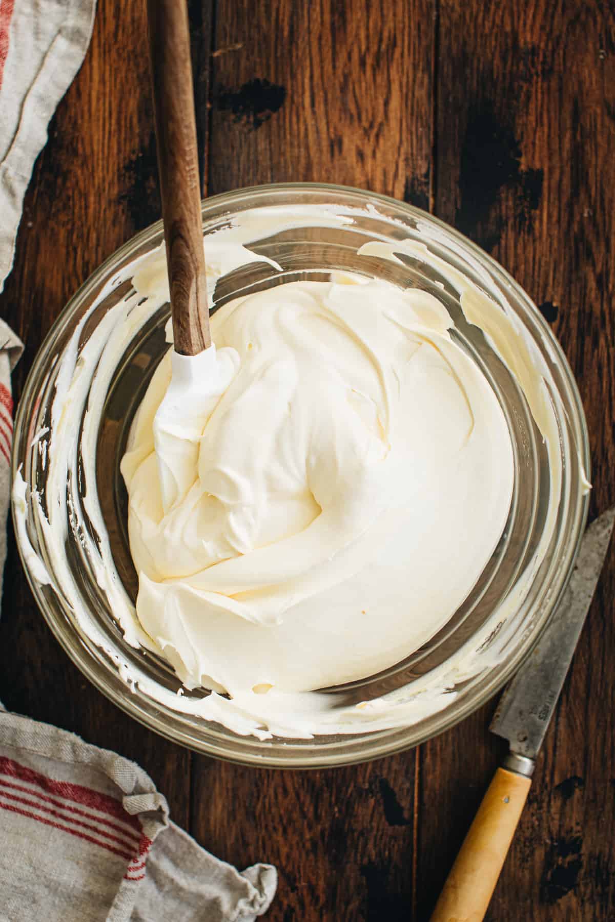 Cool Whip folded into the vanilla pudding mixture for making snickers salad.