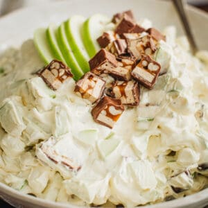 Snickers salad in a white bowl.