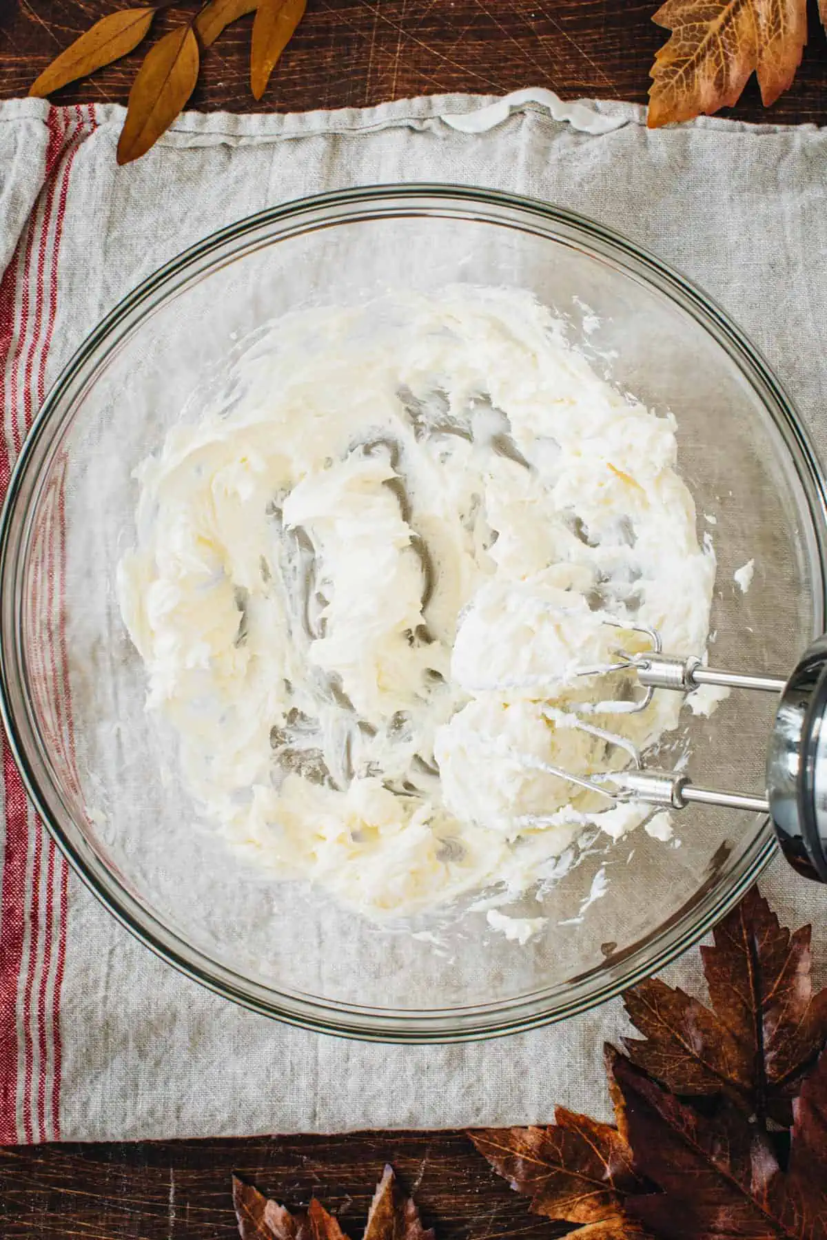 Beaten cream cheese and sugar for making spoon bread.