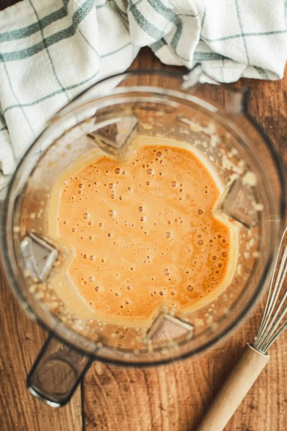 Mixed sweet potato pie filling in a blender.