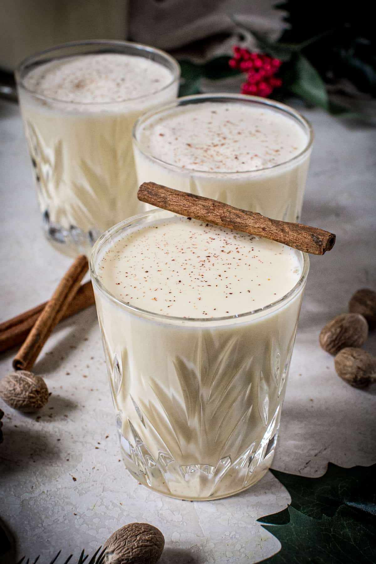 Traditional eggnog made from scratch in a glass with freshly grated nutmeg on top.