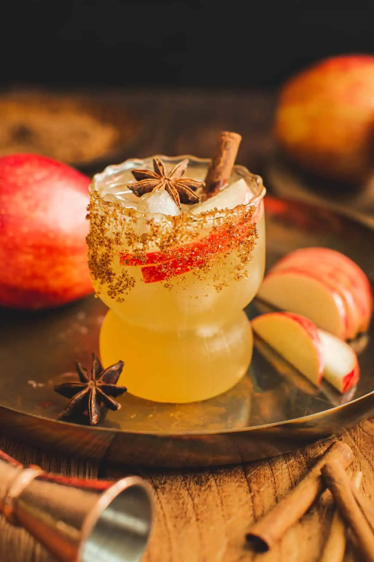 Apple Cider Margarita with a sugared rim and star anise and cinnamon sticks for garnish.