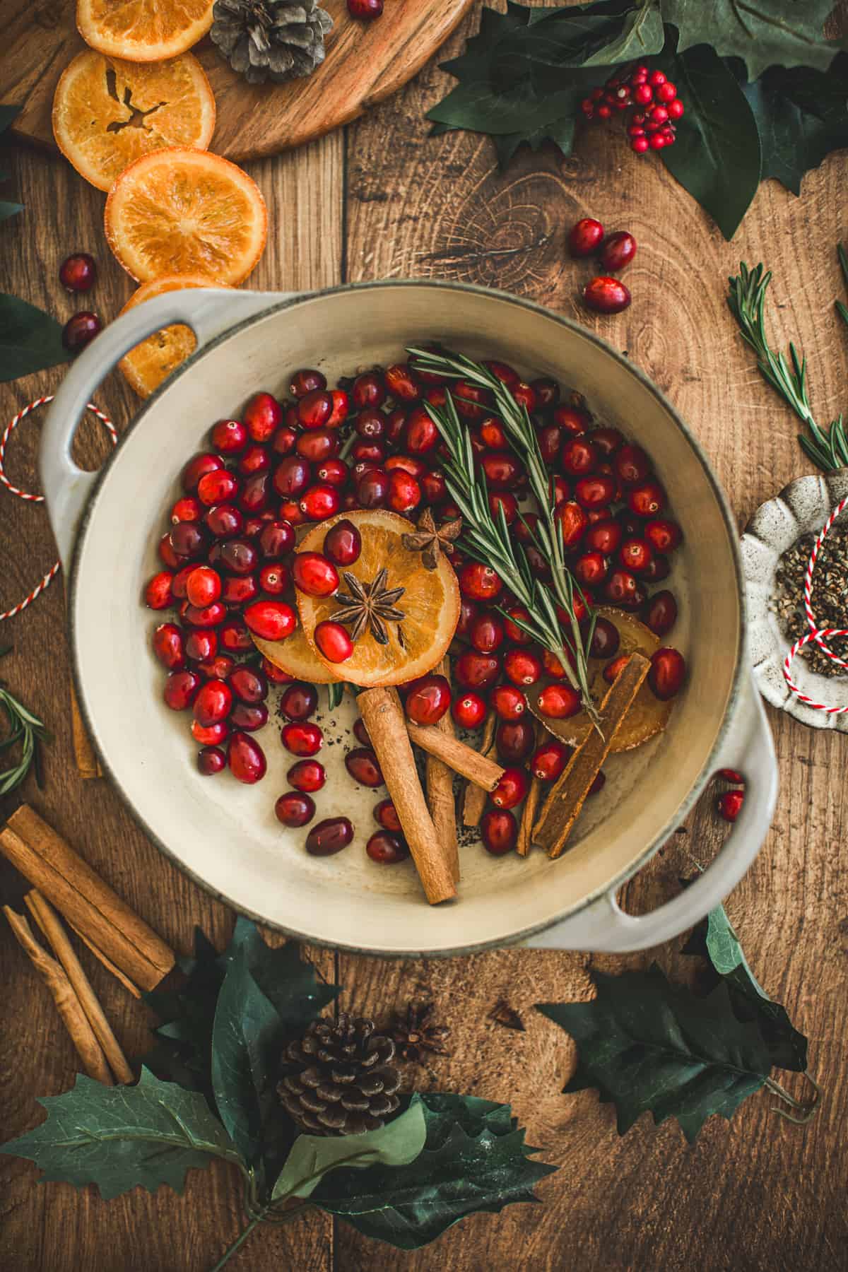 Christmas potpourri poured into a simmering pot ready to put on the stove.