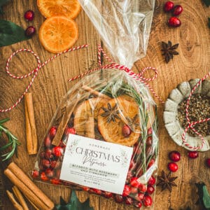 Christmas potpourri in a bag tied with string and ingredients around it.