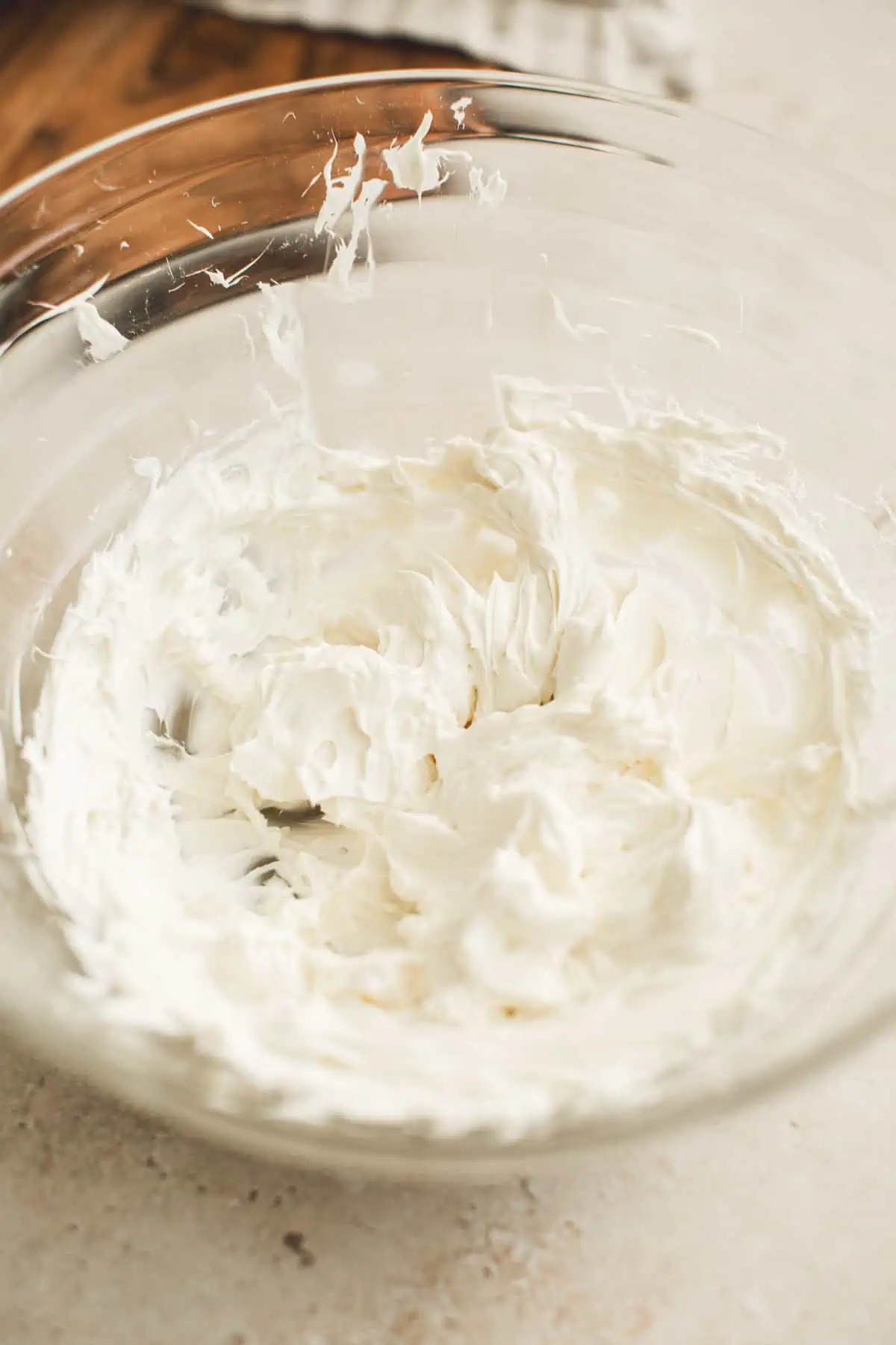 Beaten cream cheese for making clam dip.
