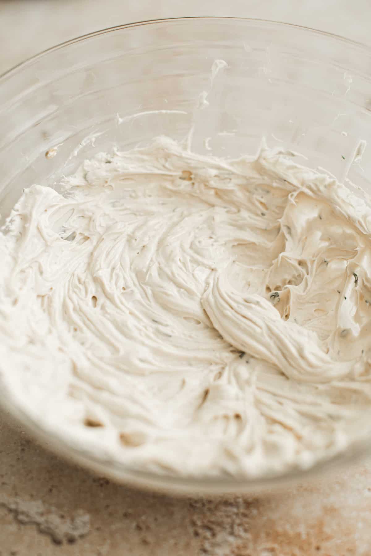 Cream cheese, sour cream, lemon juice, garlic, lemomm juice, worcestershire sauce, and hot sauce combined in a mixing bowl for the base of clam dip.