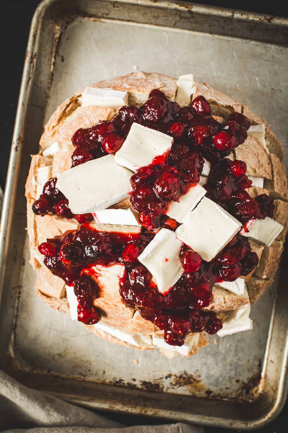 Cranberry brie pull-apart bread on a baking sheet ready to bake.