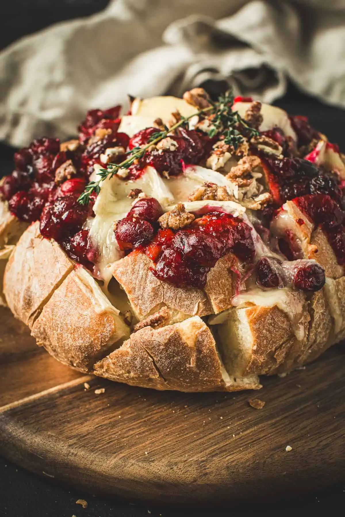 Cranberry Brie Pull-Apart Bread topped with fresh thyme.