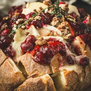 Cranberry Brie Pull-Apart Bread topped with fresh thyme.