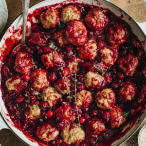 Cranberry meatballs in a large skillet.