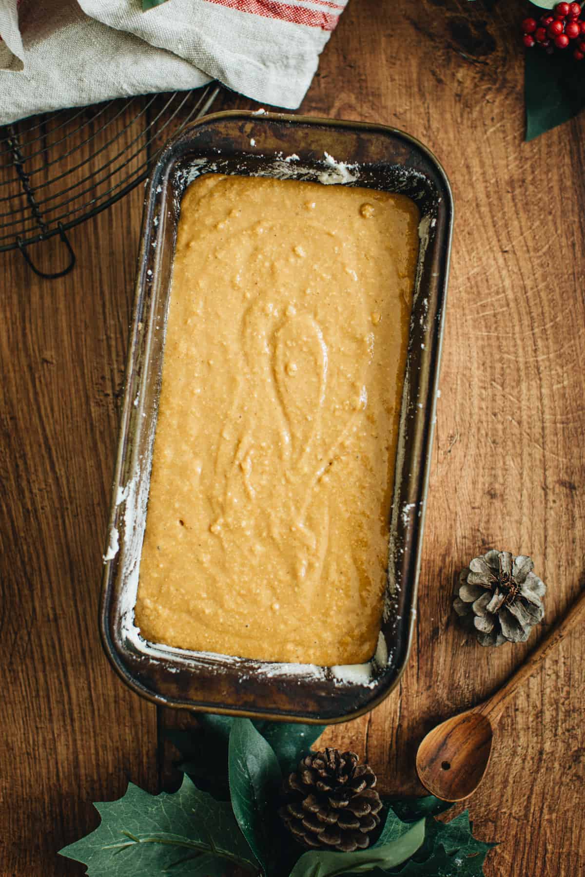 Batter for making a gingerbread loaf in a loaf pan ready to bake.