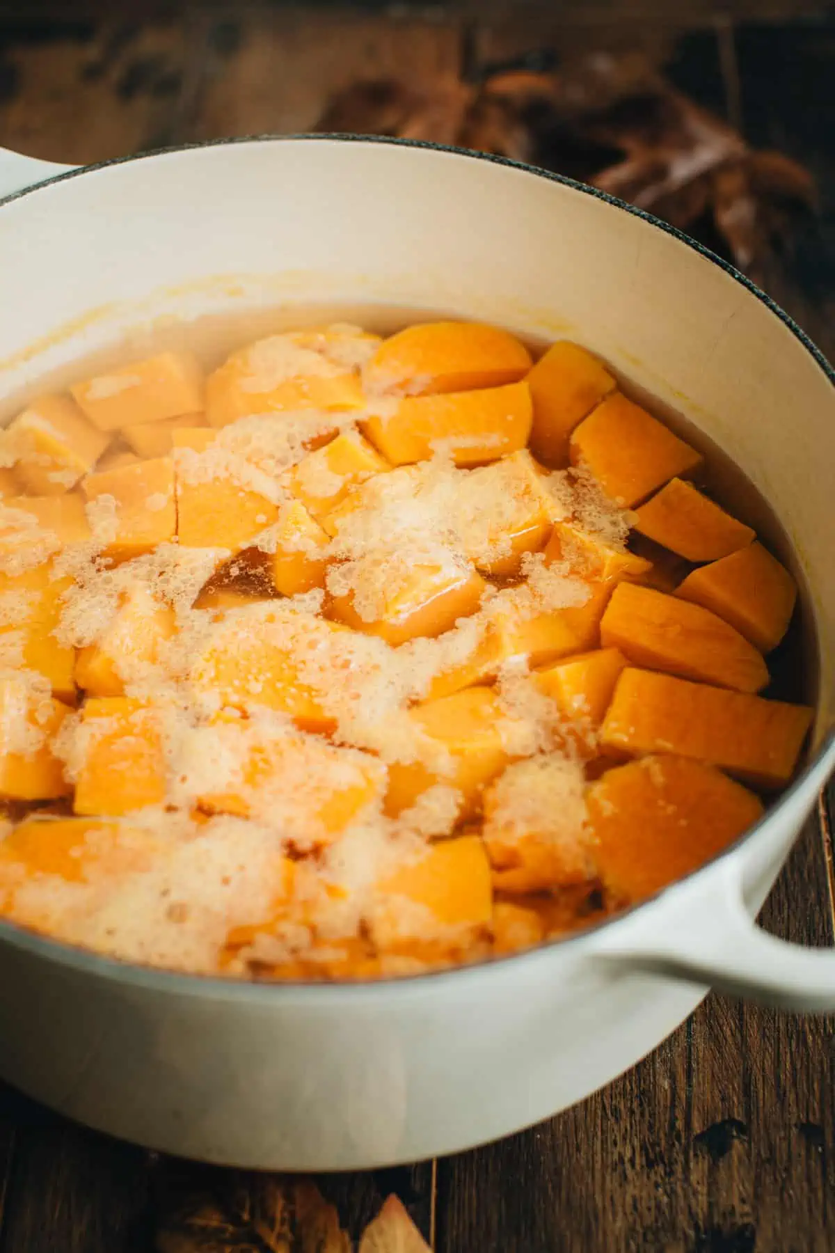 Boiling chopped sweet potatoes for making Healthy Sweet Potato Casserole.