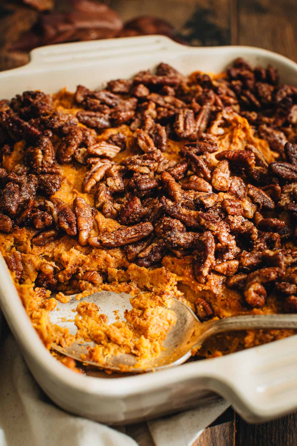 Healthy sweet potato casserole in a square baking dish.