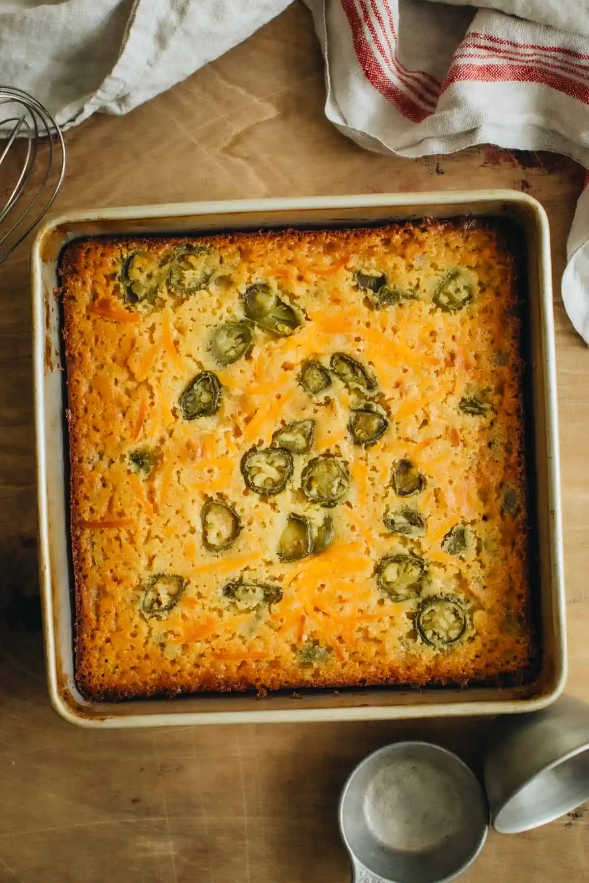 Baked jalapeño cornbread in an 8x8 baking pan.