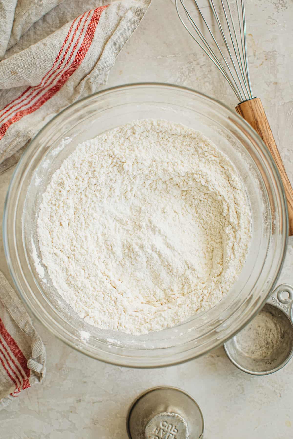 Flour and salt in a mixing bowl for making pie crust with shortening.