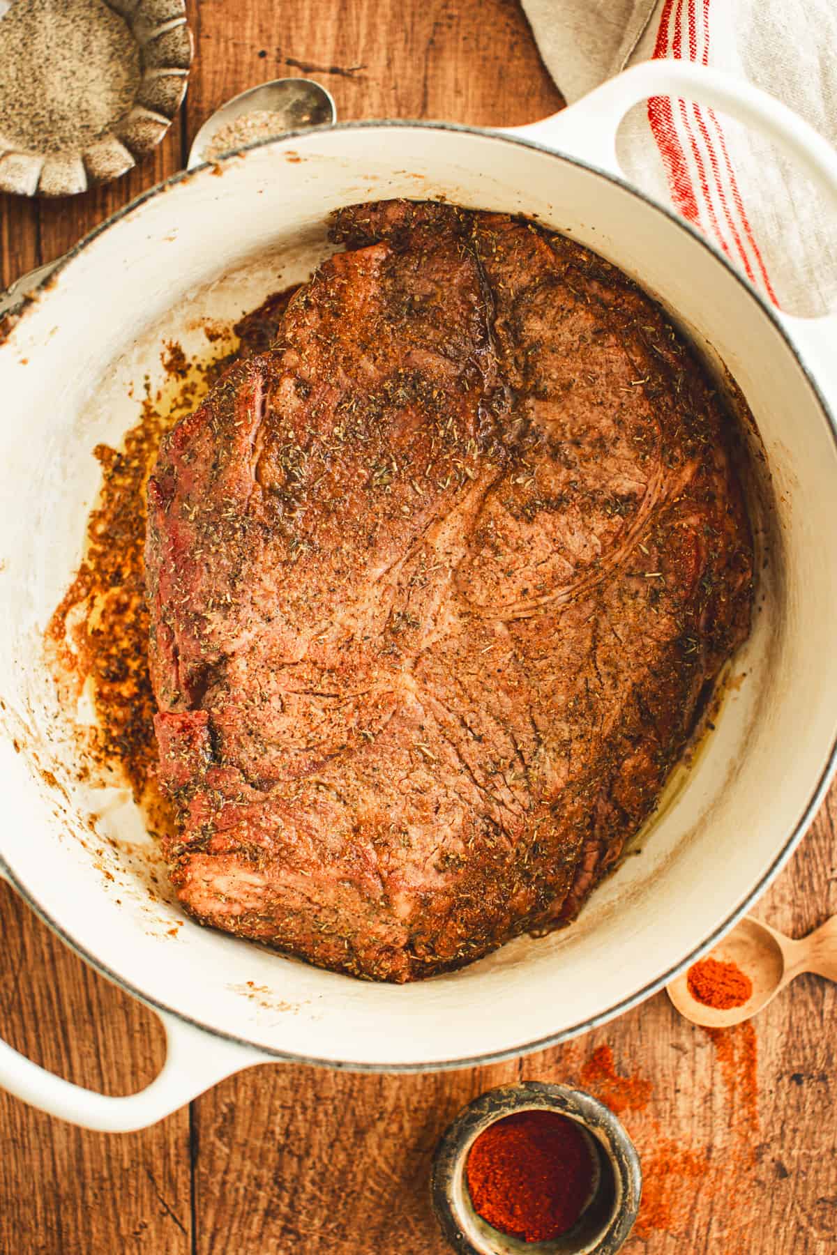 Seared chuck roast in a Dutch Oven for making Pot Roast.