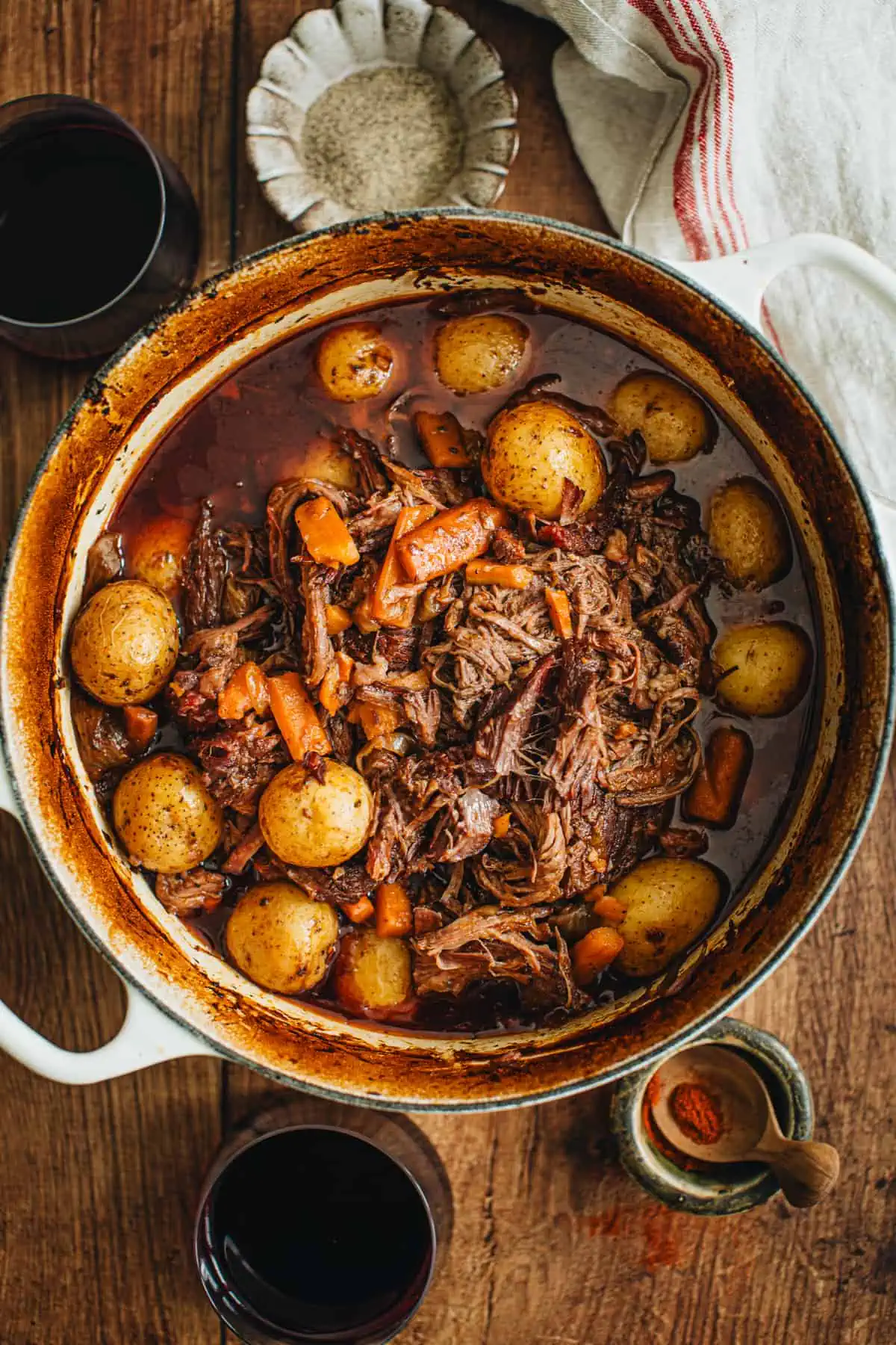 Pot roast in a white Dutch Oven.